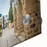 Large abstract wall art featuring a Tunisian landscape in muted earth tones on acrylic glass, ideal for dining room ambiance.