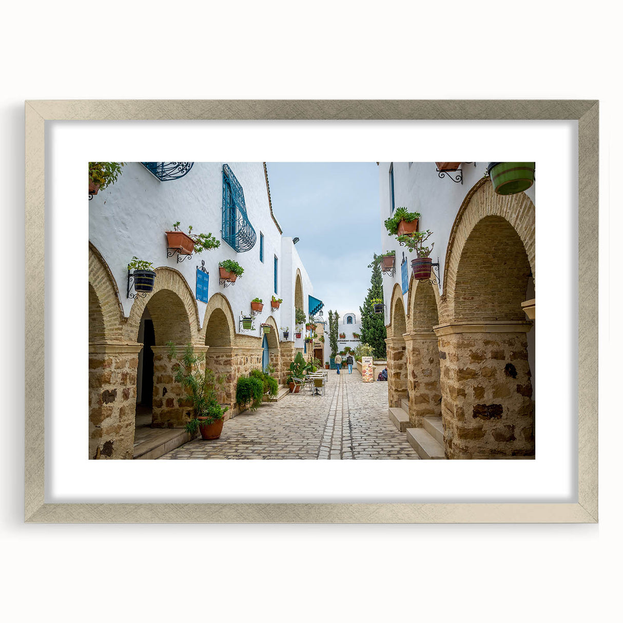 Extra large abstract art print of a textured Tunisian landscape in muted earth tones, framed in silver.