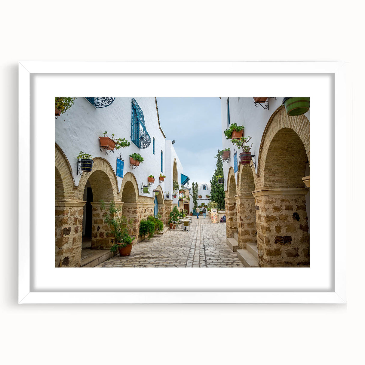 Textured abstract art print of a Tunisian landscape in earth tones on a white framed mat, ideal for bedroom art.