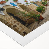 Art deco poster of a Tunisian landscape in muted earth tones on rolled canvas, suitable for dining room decor.