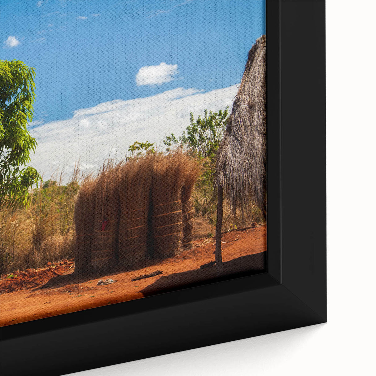Extra large framed canvas featuring a textured, colorful African scenery in black with vibrant accents.