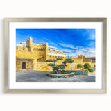 Textured abstract art print depicting rugged landscapes in muted earth tones, framed in silver, ideal for bedroom art.
