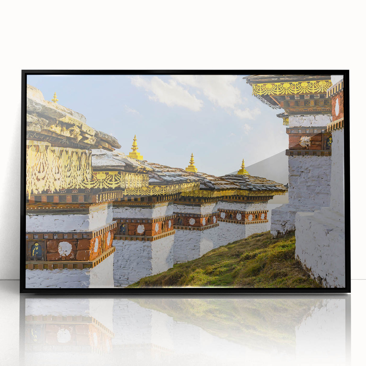 Large abstract wall art featuring a Bhutanese landscape in muted earth tones, framed in black acrylic.