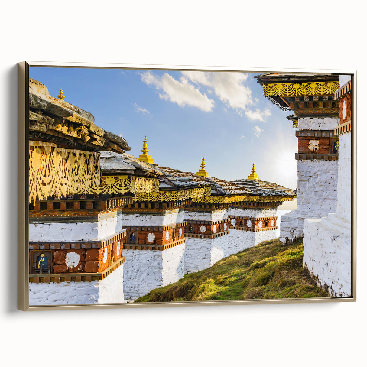 Framed canvas wall art featuring a serene Bhutanese landscape in muted gold and black tones, suitable for bedroom decor.