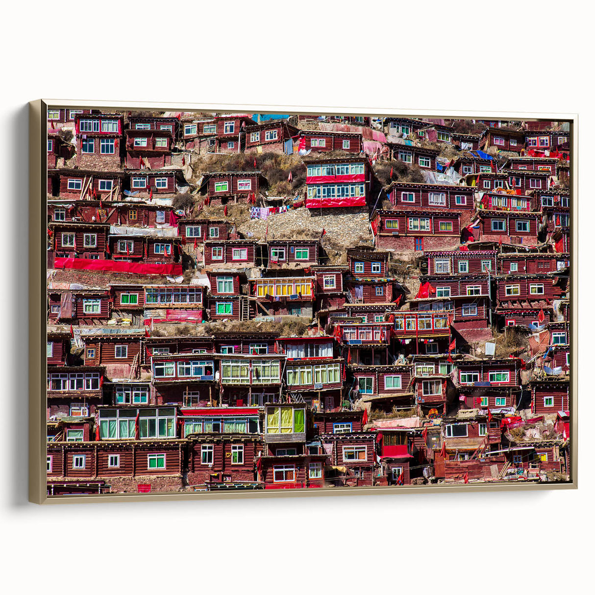 Vintage poster art of Tibetan scenery on framed canvas, featuring colorful art in gold and black.