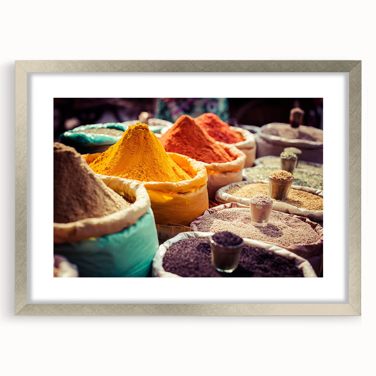 Textured art print of an abstract Indian landscape in earthy tones, framed in silver, ideal for bedroom art.