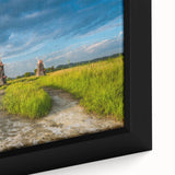 Extra large framed canvas featuring a textured, colorful abstract scene with prominent black elements.