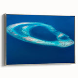 Framed canvas featuring a serene Maldivian landscape with vibrant blue waters and lush greenery, ideal for living room decor.