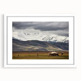 Abstract art print depicting a Mongolian landscape in muted earth tones on a framed white mat, ideal for dining room decor.