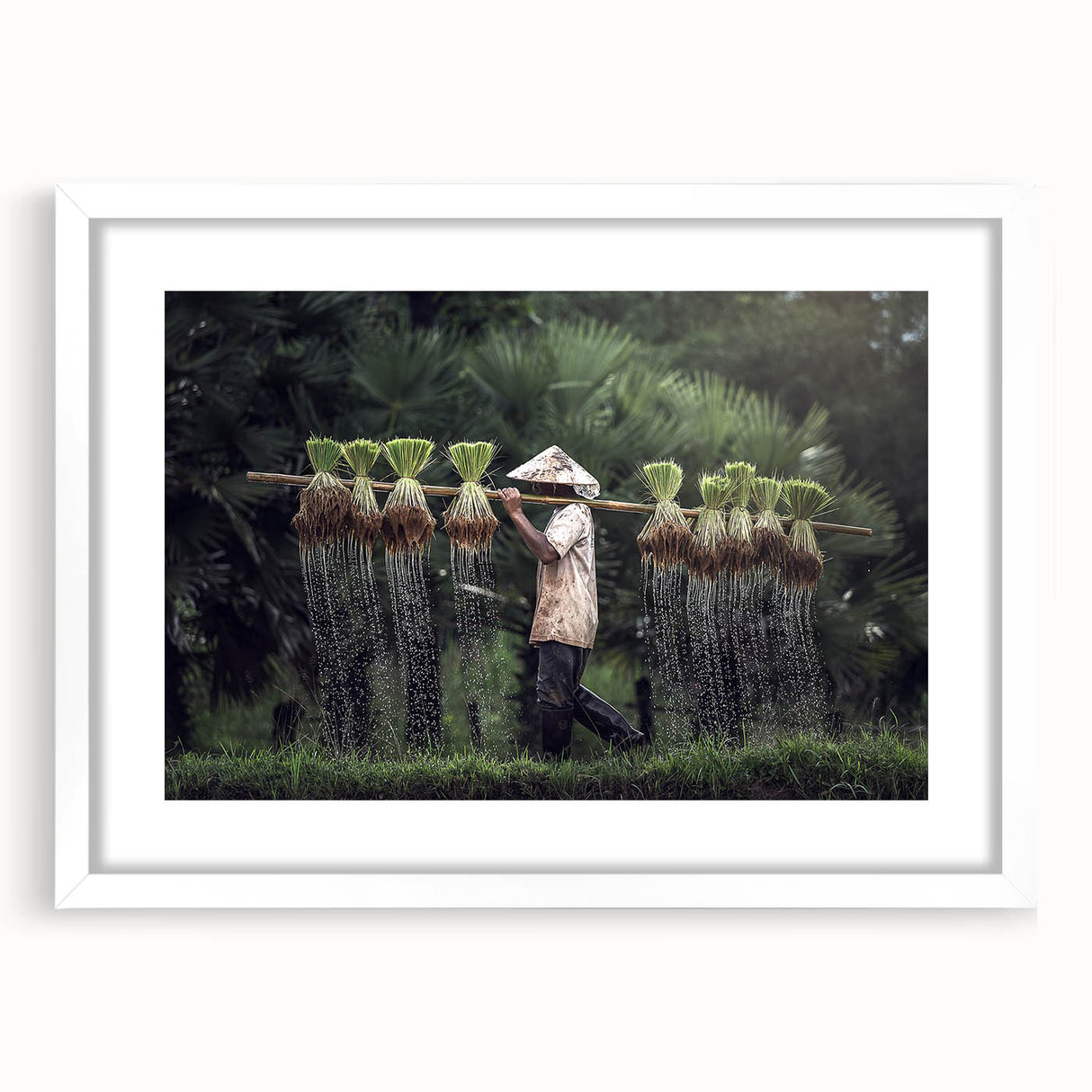 Abstract art print of a serene Thai landscape in soft blue and green hues, framed in white.