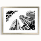 Abstract art print of Brisbane skyline in muted blue and silver tones on a framed canvas, suitable for dining room decor.