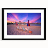 Abstract art print of colorful, textured scenery, set in a black frame, ideal for living room decor.