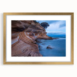 Textured abstract art print of Tasmania scenery in muted earth tones on a gold-framed canvas, suitable for bedroom decor.