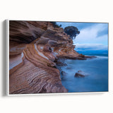 Framed canvas featuring a vintage-style landscape art painting of Tasmania with colorful elements on a black background.