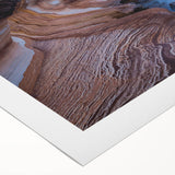 Art deco poster featuring a Tasmanian landscape in muted green and brown hues on rolled canvas.