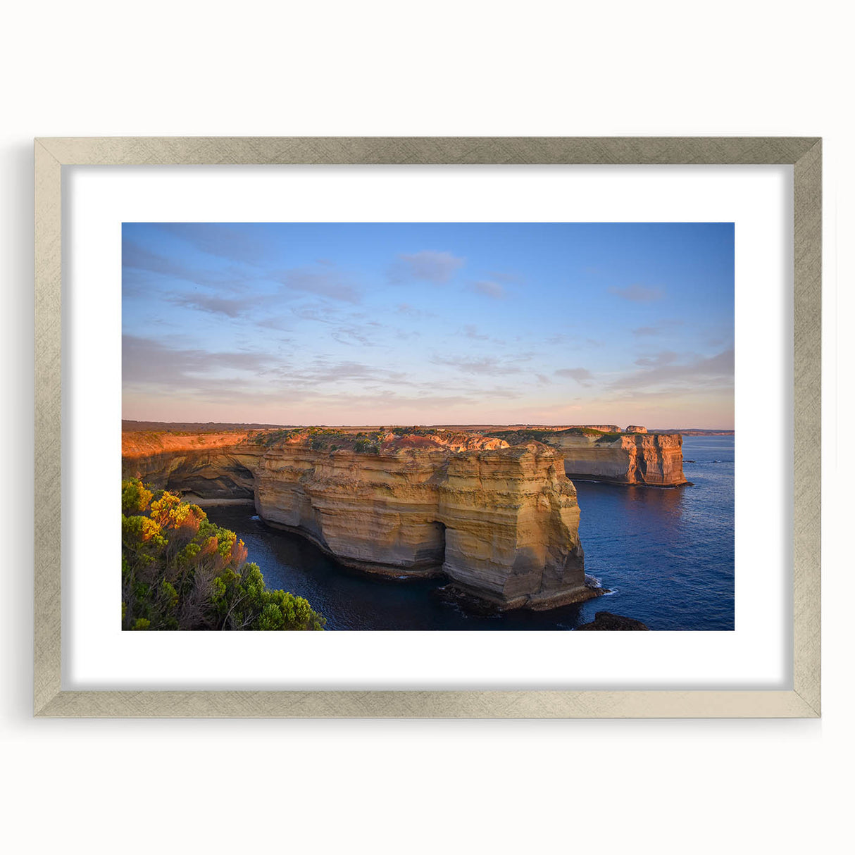 Extra large abstract art print depicting a textured Australian landscape in muted earth tones, framed in silver.