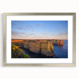 Extra large abstract art print depicting a textured Australian landscape in muted earth tones, framed in silver.