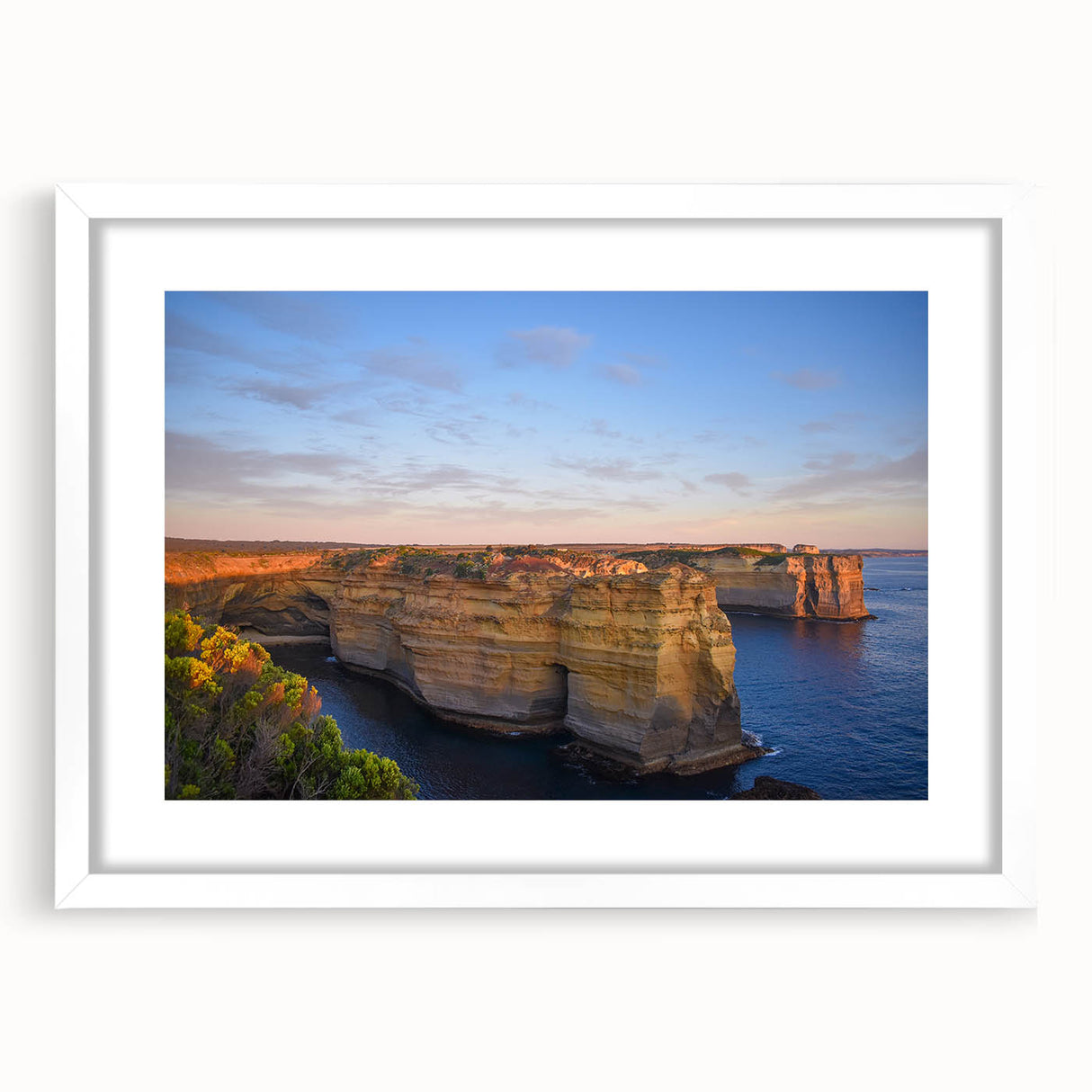 Textured abstract art print of an Australian landscape in muted earth tones on a framed canvas, suitable for bedroom decor.