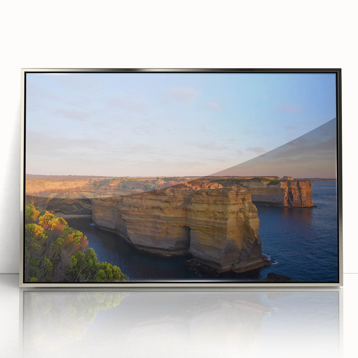 Large art print of an Australian landscape in muted earth tones on a silver-framed acrylic.