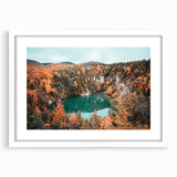 Abstract art print of a Nova Scotia scenery in muted blue and green tones, framed with a white mat.