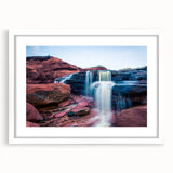 Abstract art print of Prince Edward Island in muted blue and green tones on a white framed canvas.