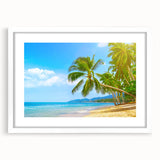 Textured art print depicting abstract Caribbean scenery in blue and white tones, framed with a white mat.