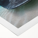 Art deco poster of a Caribbean scenery on rolled canvas, featuring vivid blue and green tones.