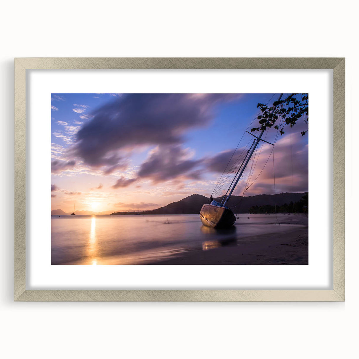 Extra large abstract art print depicting Caribbean scenery in textured hues of blue and green, framed in silver.