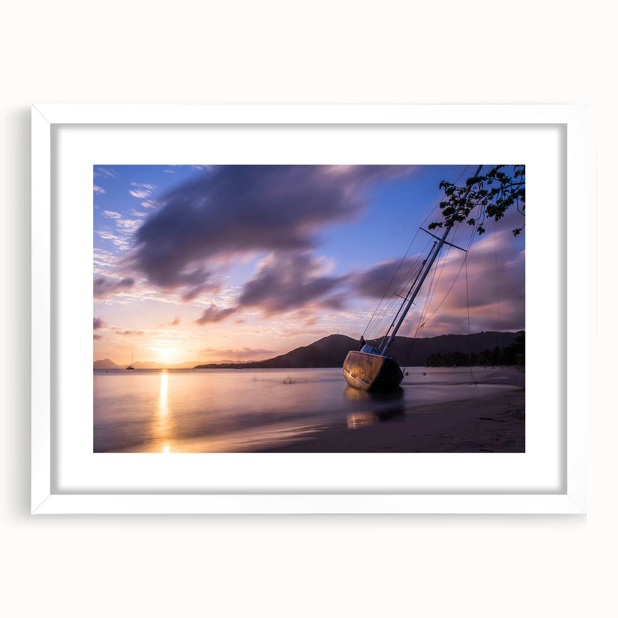 Textured abstract art print depicting a Caribbean scenery in muted blue and green hues on a framed canvas.