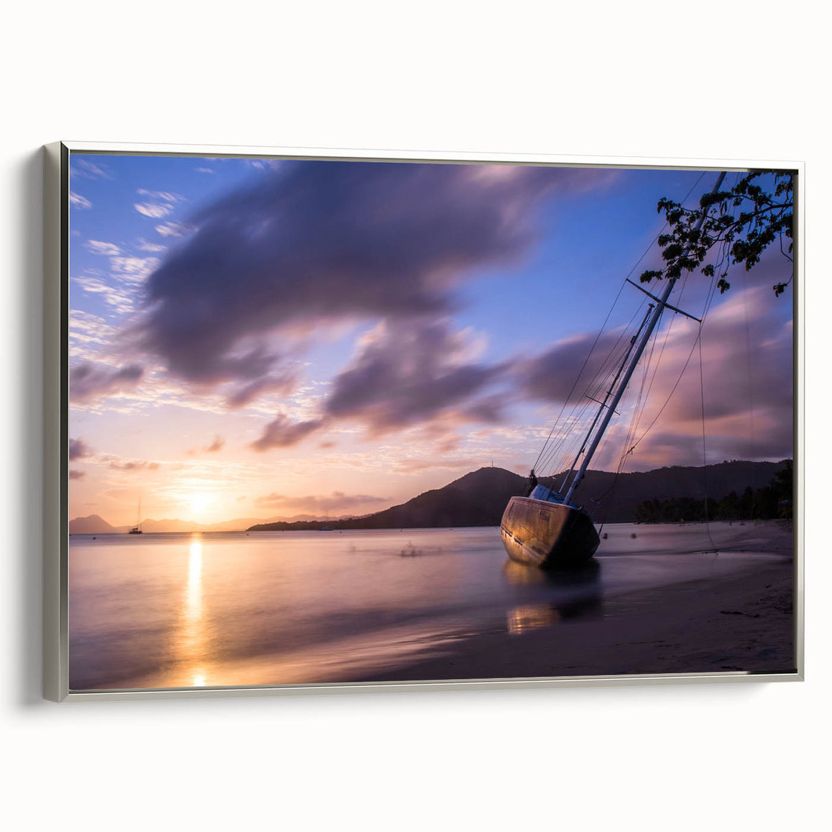 Framed canvas of a Caribbean landscape painting featuring vibrant blue and green tones.