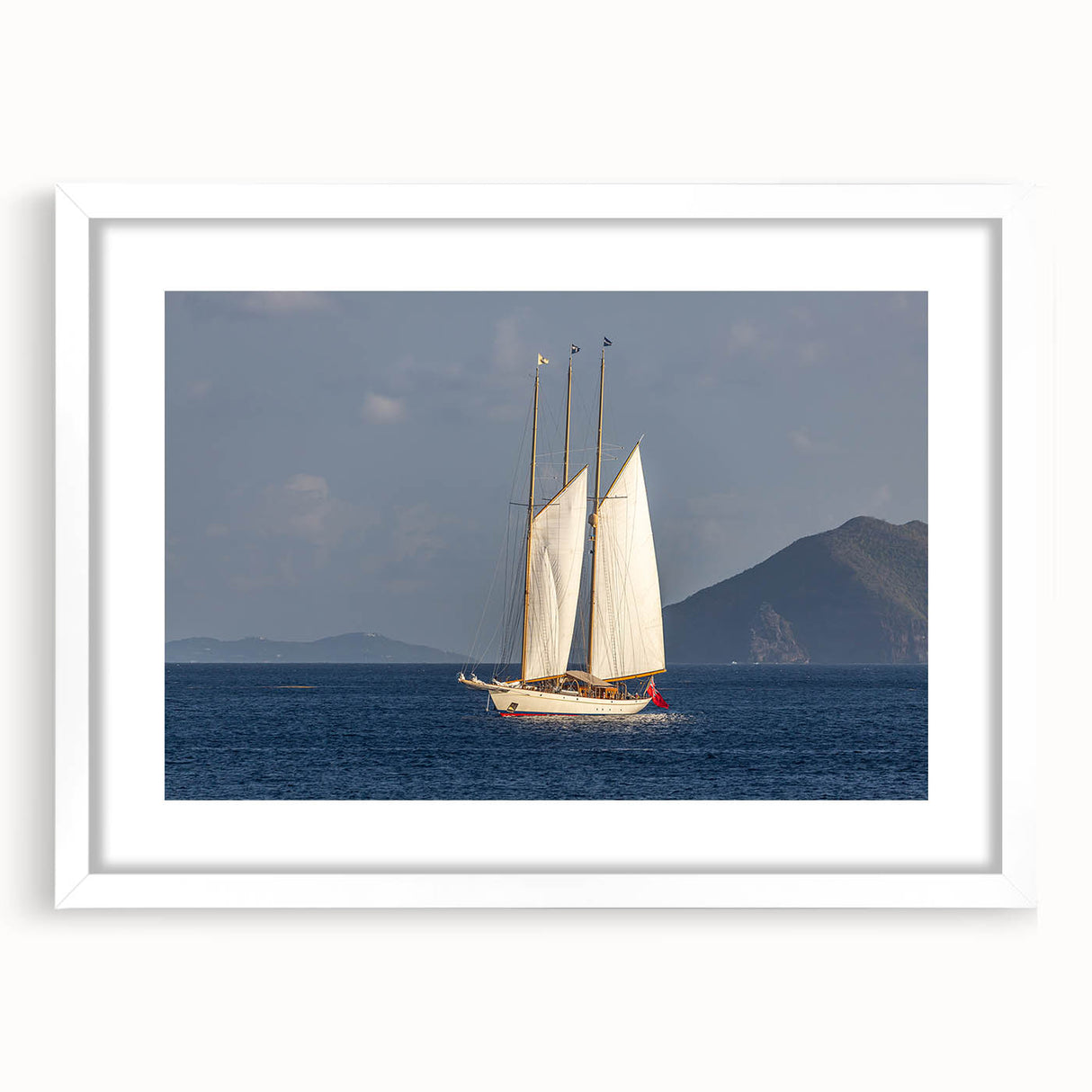 Textured abstract art print of Caribbean scenery with vivid blue and green tones on a framed white mat.