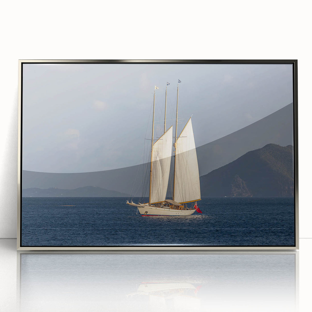 Large art print of Caribbean scenery with vibrant blue and green tones on a silver-framed acrylic.