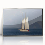 Large art print of Caribbean scenery with vibrant blue and green tones on a silver-framed acrylic.