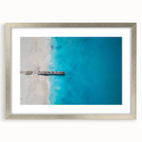 Extra large abstract art print of Caribbean scenery in textured style, with vibrant blue and green hues, framed in silver.