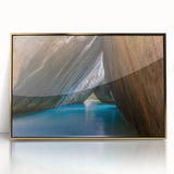 Acrylic print of a Caribbean scenery with vibrant blue waters and lush green islands, framed in gold.