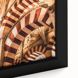 Close-up of a textured black wall art featuring a colorful Central American scenery on a framed canvas.