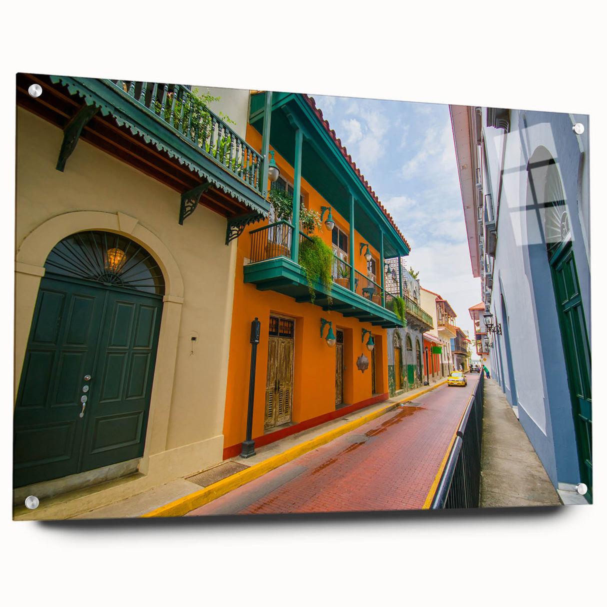 Large abstract wall art of Central American scenery on acrylic glass, with vibrant green and blue tones.