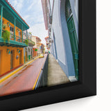 Extra large black wall art of a textured, colorful Central American scenery on a framed canvas, ideal for living room decor.