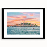 Abstract art print of a vibrant Croatian landscape in textured colors, framed in black, ideal for living room decor.