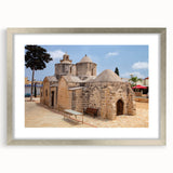 Extra large abstract art print of a textured European landscape in muted earth tones, framed in silver.