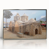 Large acrylic print of a European Cyprus landscape in muted earth tones, framed in silver.