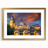 Extra large abstract art print of Prague skyline in muted earth tones on a textured canvas, framed in gold.