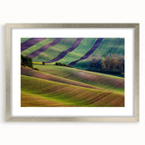 Extra large abstract art print of a textured European scenery in muted earth tones, framed in silver.