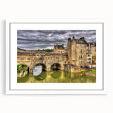 Textured abstract art print of a European scenery in muted earth tones, framed with a white mat, suitable for bedroom decor.