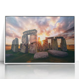 Mid-century modernist art depicting Stonehenge with muted earth tones on a white framed acrylic print.