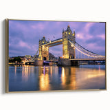 Framed canvas featuring a vintage-style painting of the Tower Bridge in England with muted gold and black tones.