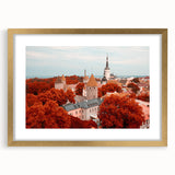 Abstract art print of a European scenery in muted earth tones on a gold-framed canvas.