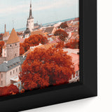 Black wall art featuring a textured depiction of a European cityscape in vibrant colors on a framed canvas.