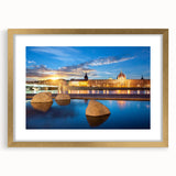 Abstract art print of Lyon cityscape in muted gold and gray tones, framed with a gold mat, ideal for dining room decor.