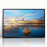 Large abstract wall art depicting a stylized Lyon cityscape in muted gray and blue tones on a framed acrylic.